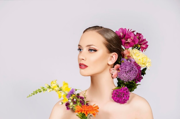 Beauty and make up fashion model portrait with blossom flowers