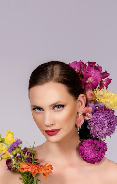 Beauty and make up fashion model portrait with blossom flowers