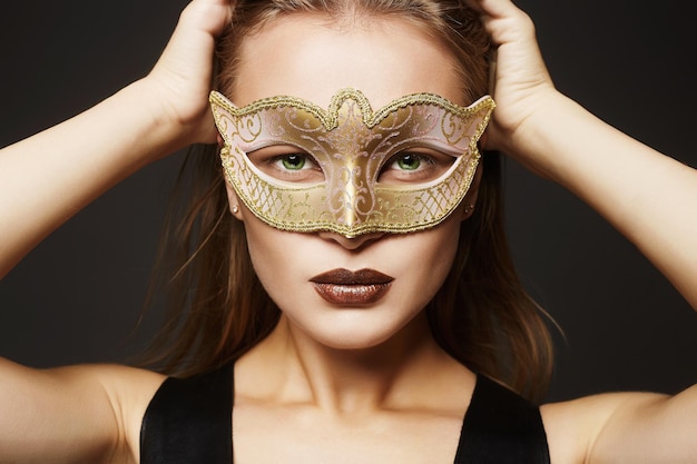 Beauty model girl in Carnival Mask