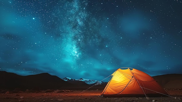 The beauty of nature is on full display in this stunning image A lone tent sits in the foreground dwarfed by the majestic mountains in the distance