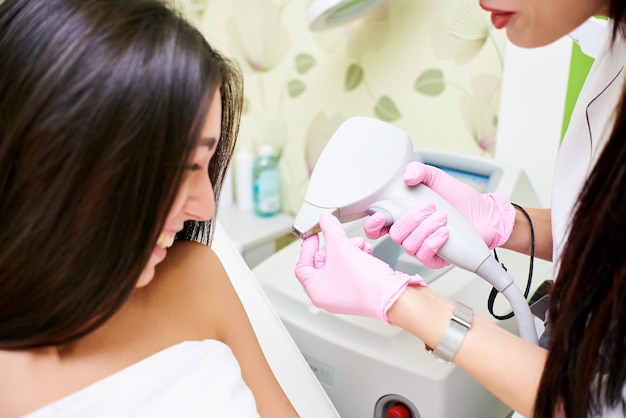 Beauty parlor, laser hair removal, doctor and patient