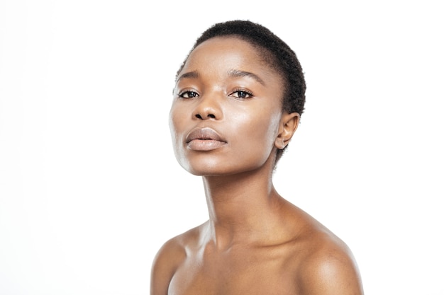 Beauty portrait of afro american woman with fresh skin looking at camera isolated on a white background