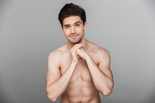 Beauty portrait of fit half naked smiling young man