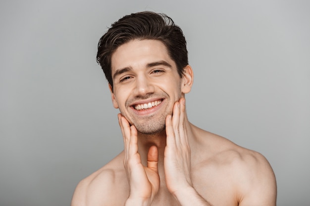 Beauty portrait of half naked smiling young man