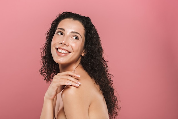 Beauty portrait of a smiling young topless woman