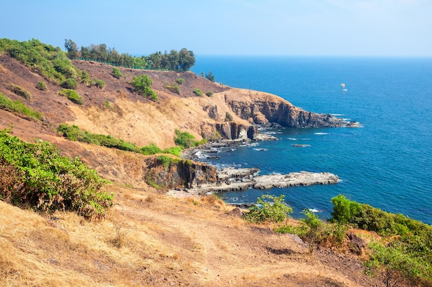 Beauty rocks on Sinquerim Beach aerial panoramic view. Its located near the Fort Aguada and its lighthouse in Goa, India.