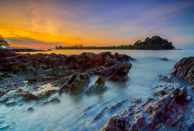 Beauty sunset on the beach with coral along the coast Batam island