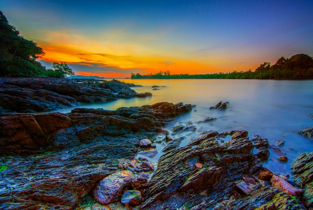 Beauty sunset on the beach with coral along the coast Batam island