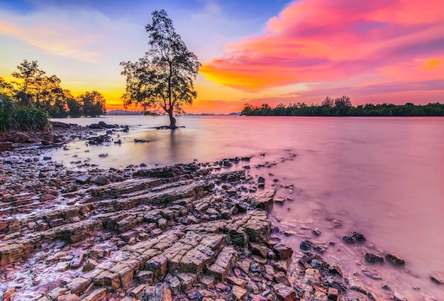 Beauty sunset on the beach with coral along the coast Batam island