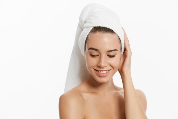 beauty woman wearing hair towel after beauty treatment. 