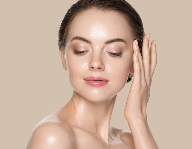 Beauty woman with hands healthy  natural make up clean fresh skin  concept color background brown