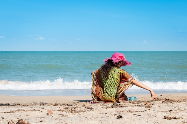 Beauty women sitting at the beach