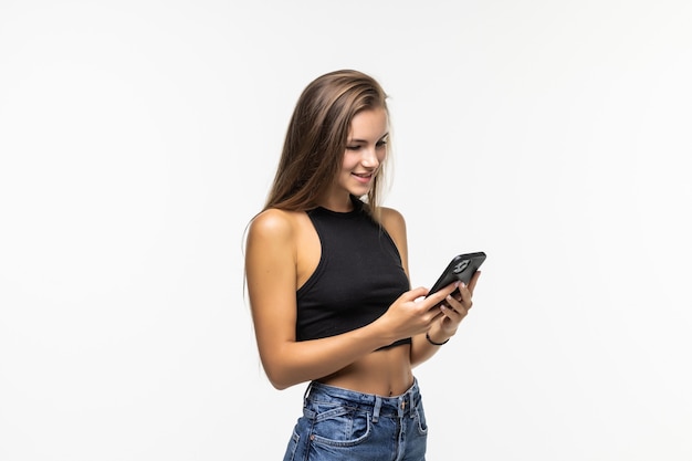 Beauty young woman using and reading a smart phone isolated on a white