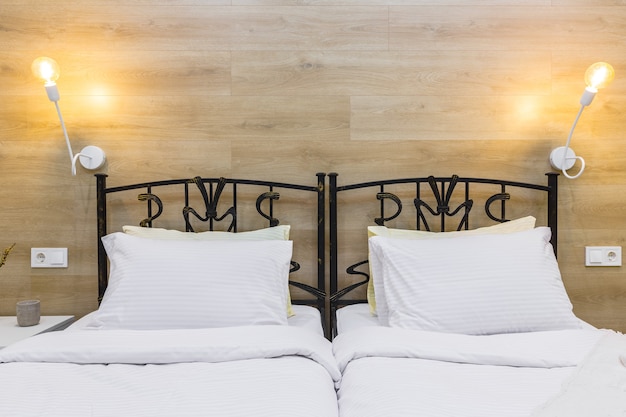 Bedroom in a modern small hotel apartment, with a large bed