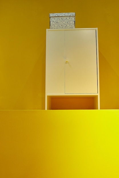 Bedside table on a yellow background storage concept