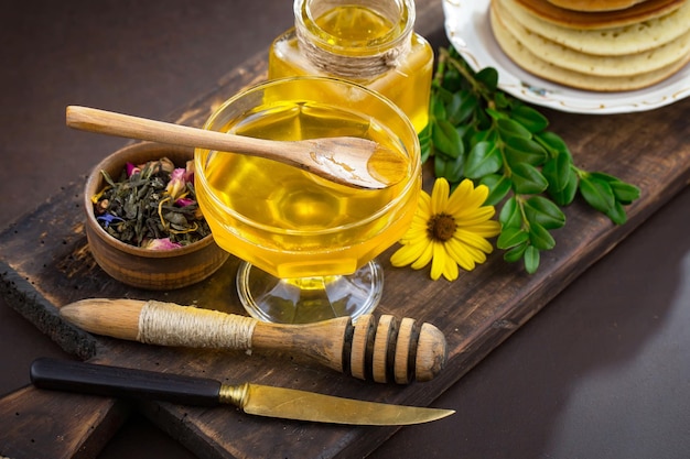 Bee honey in a composition with flowers