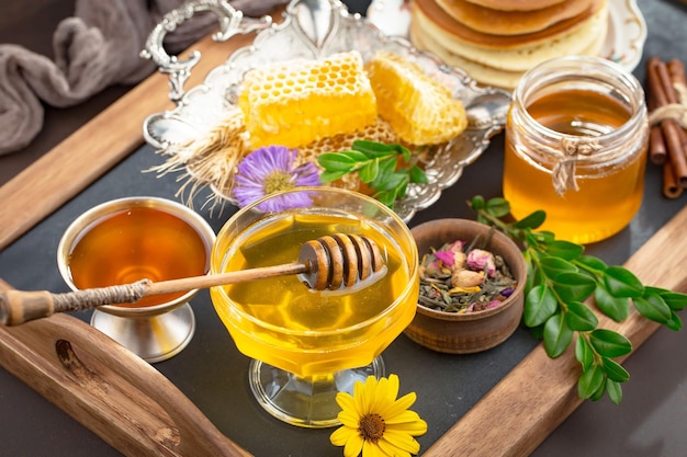 Bee honey in a composition with flowers