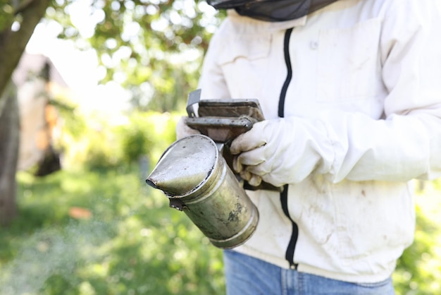 Bee smoker is device used in beekeeping to calm honey bees beekeeping concept