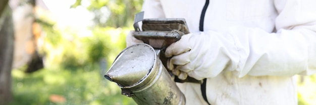 Bee smoker is device used in beekeeping to calm honey bees beekeeping concept