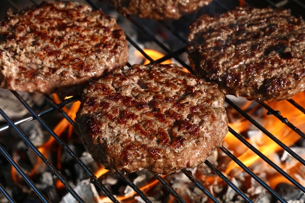 Beef burger for hamburger on barbecue flame grill