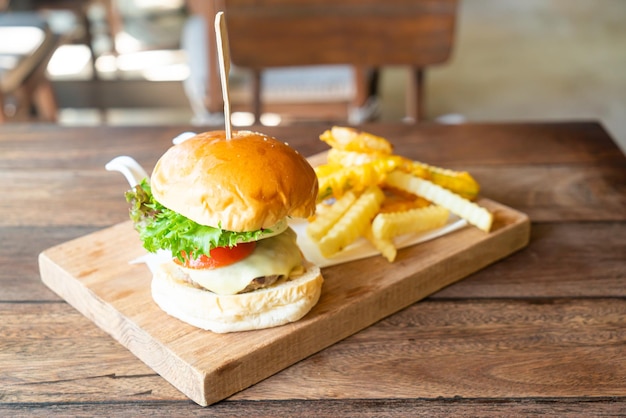 Beef burger with cheese and potato chips