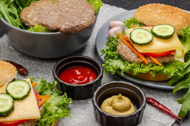 Beef burger with greens in bowl Cheeseburger with cucumber greens and carrots