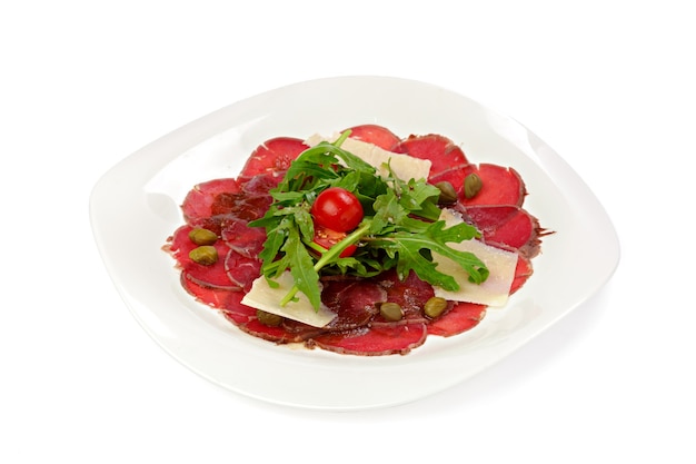 Beef carpaccio appetizer with ruccola isolated 