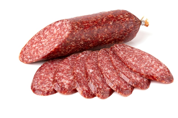 Beef Dried smoked Salami sausage basil leaves and peppercorns closeup isolated on a white background