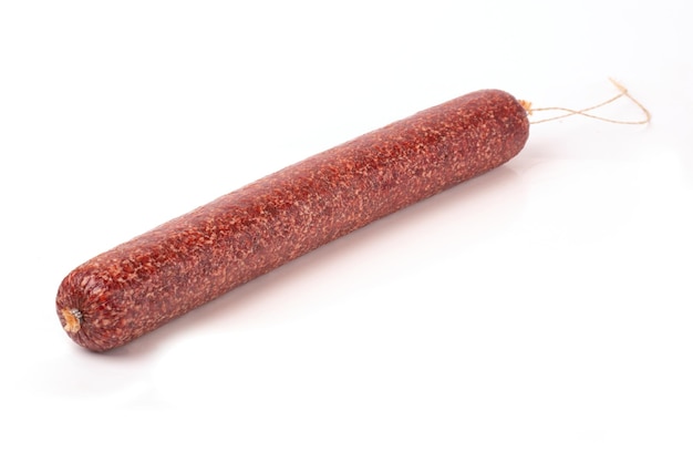 Beef Dried Smoked Salami sausage in closeup isolated on a white background