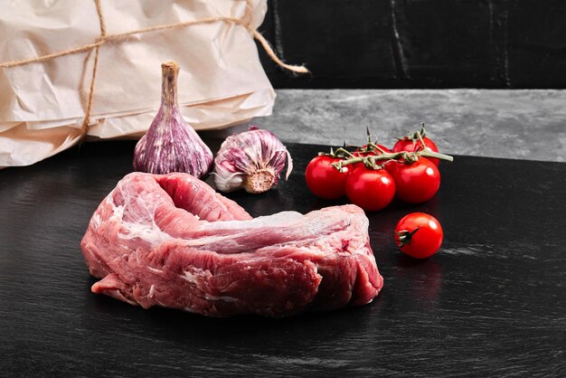 Beef raw fillet tenderloin on black marble background