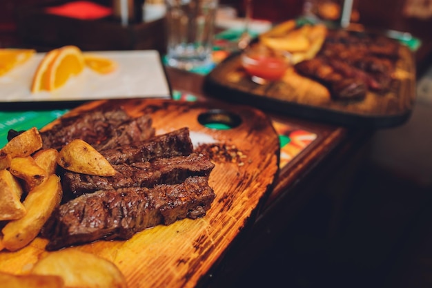 Beef ribs in bbq sauce and baked potatoesselective focus