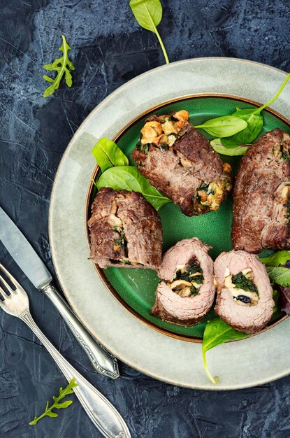 Beef rolls with mushrooms and greens