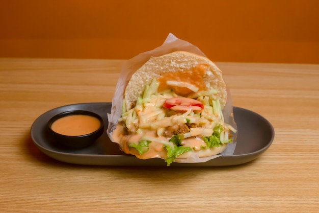 Beef Shawarma with dip served in dish isolated on table top view bangladeshi food