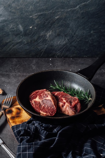 beef steak on black table background