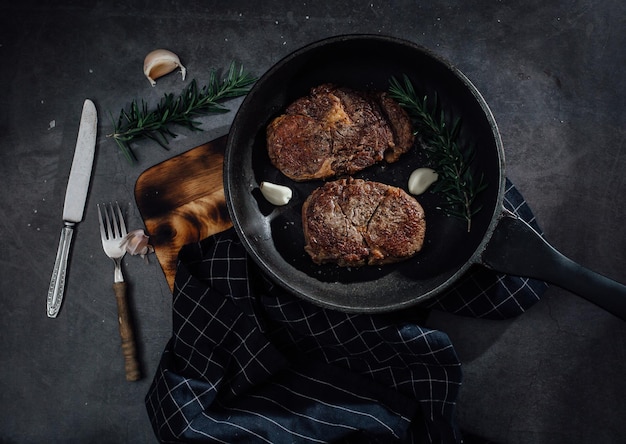 beef steak on black table background