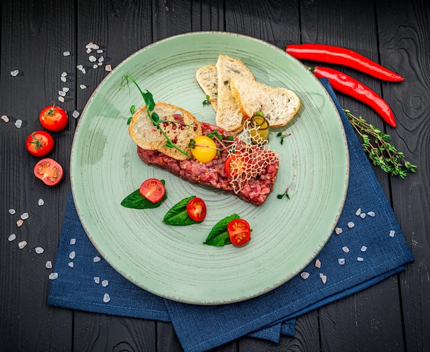 Beef steak tartare with raw egg yolk