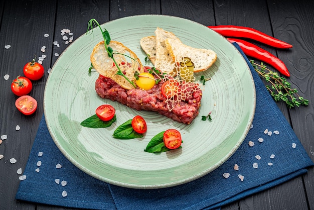 Beef steak tartare with raw egg yolk