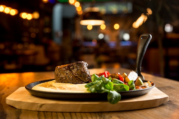 Beef steak with mashed potatoes and grilled vegetables