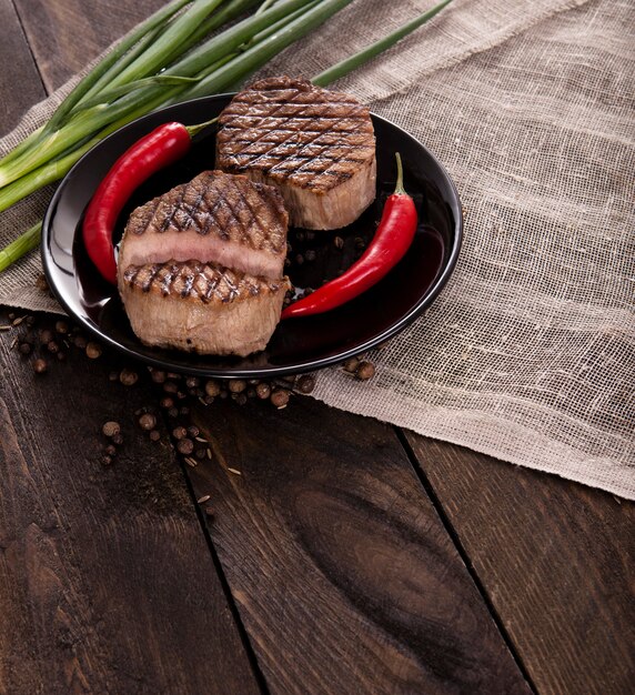 Beef steak on a wooden background