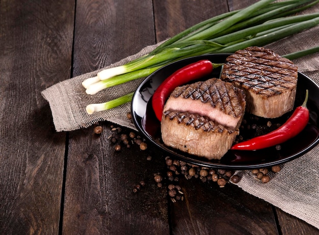 Beef steak on a wooden background