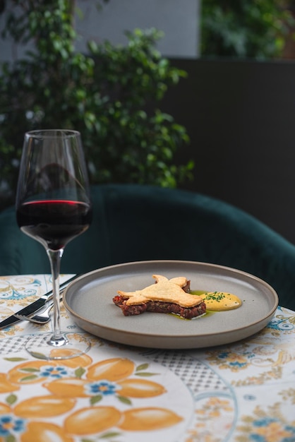 Beef tartare with mushrooms truffle and capers on a plate Serving in the restaurant