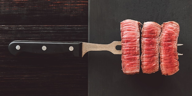 Beefsteak on cutting board