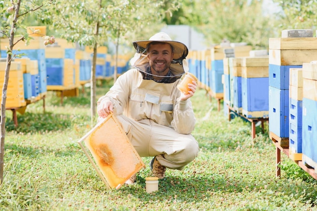 Beekeeper working collect honey Beekeeping concept