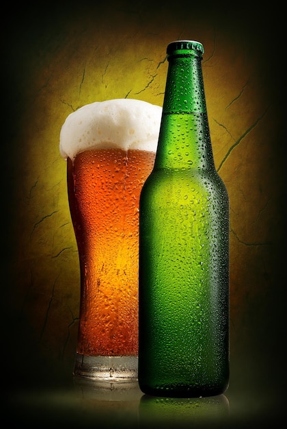 Beer in glass and bottle near old clay wall