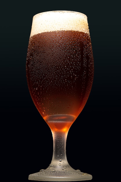 Beer, glass of cold beer with dark background