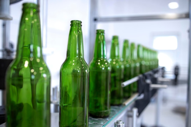 Beer production plant and glass bottles on conveyor machine