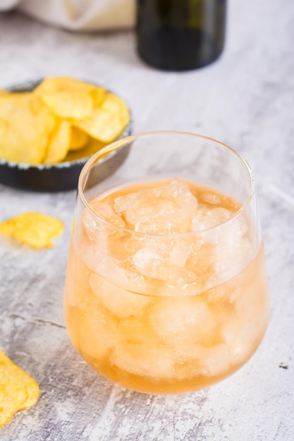 Beer slush in a glass on the table Frozen trendy summer drink Closeup