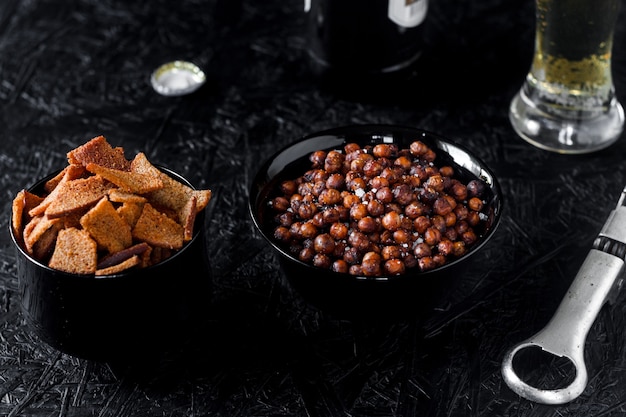 Beer snacks. Beer on a dark background.