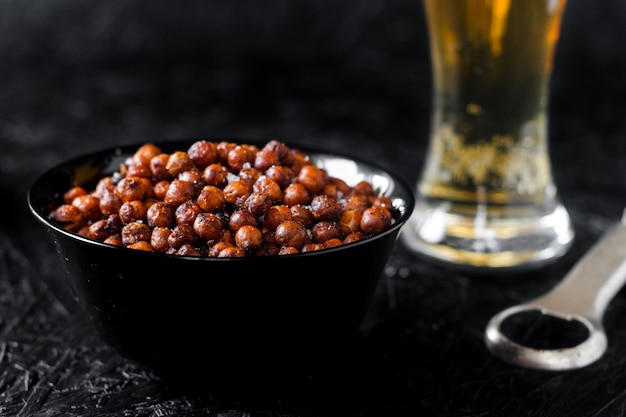 Beer snacks. Beer on a dark background.