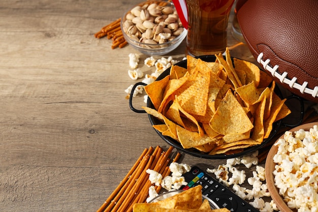 Beer with snacks and a rugby ball